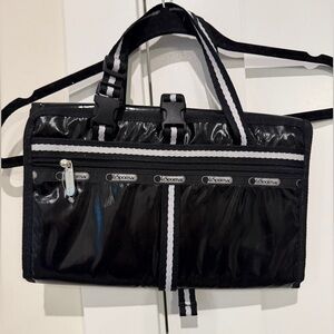 LeSportsac Black Nylon Parent Toiletry Bag with White Stripe Trim